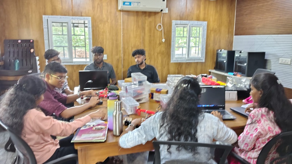 Trainees collaborating on UAV systems in workshop