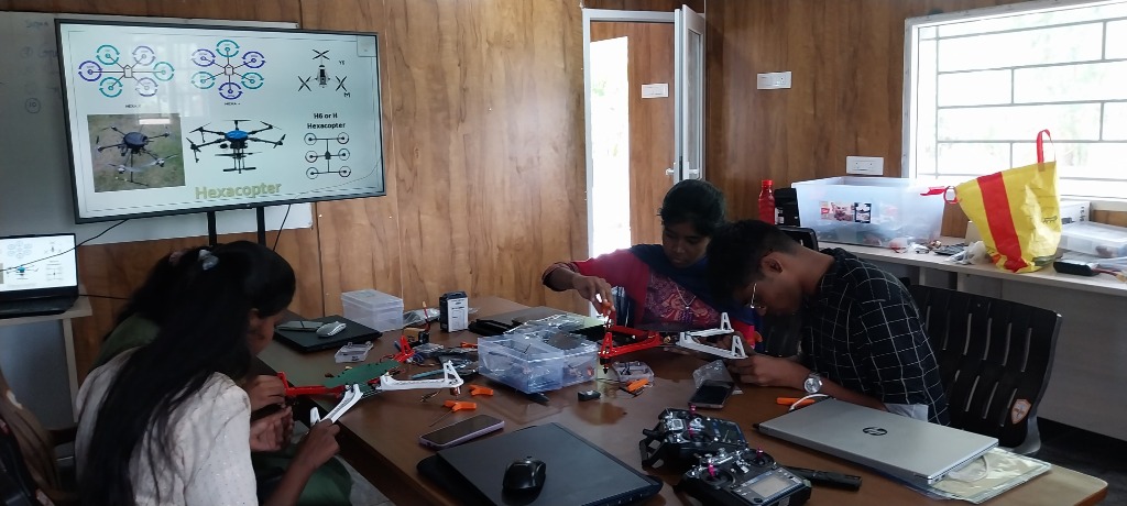 Students assembling a custom hexacopter drone